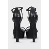 Black leather high-heeled sandals