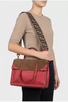 Leather bag with a belt in a signature print
