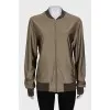 Bomber jacket with a zipper and elastic band