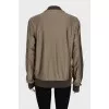 Bomber jacket with a zipper and elastic band