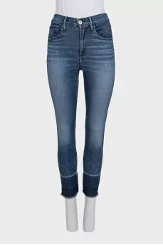 Blue jeans with fringe on the legs