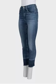 Blue jeans with fringe on the legs