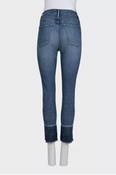 Blue jeans with fringe on the legs