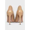 Beige leather pumps