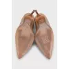 Beige leather pumps
