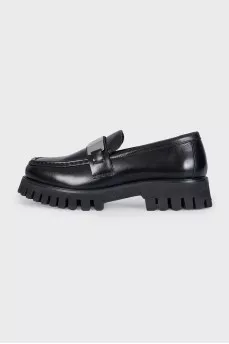 Black loafers with logo