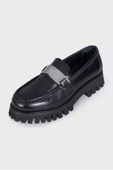 Black loafers with logo
