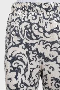 Black and white trousers decorated with sequins
