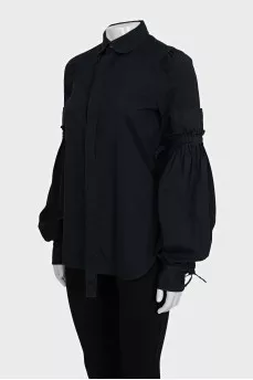 Black shirt with ties on the sleeves
