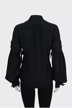 Black shirt with ties on the sleeves