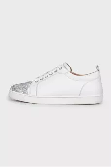White sneakers decorated with rhinestones