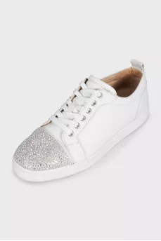 White sneakers decorated with rhinestones