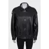 Slim-fit leather jacket with a zipper and buttons