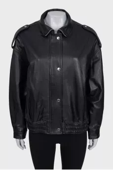 Slim-fit leather jacket with a zipper and buttons