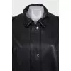 Slim-fit leather jacket with a zipper and buttons