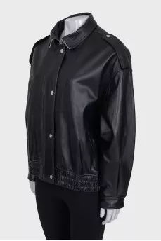 Slim-fit leather jacket with a zipper and buttons