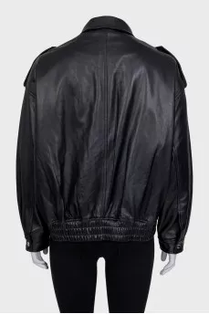 Slim-fit leather jacket with a zipper and buttons