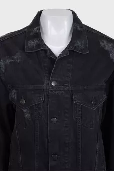 Black denim jacket with a distressed effect