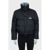 Black zip-up jacket with logo