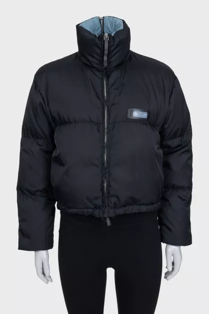 Black zip-up jacket with logo