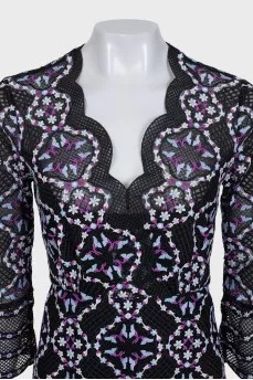 A fitted lace dress with embroidery
