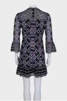 A fitted lace dress with embroidery