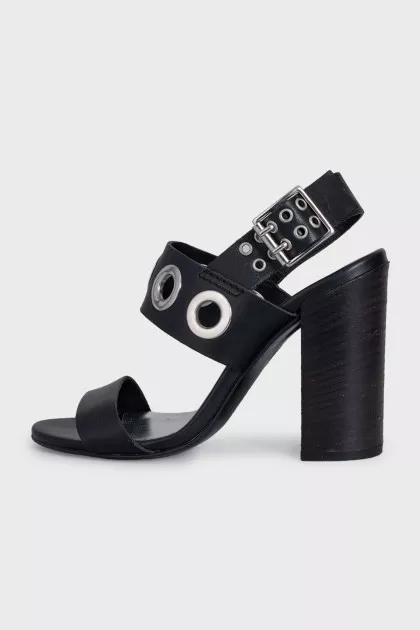 Leather sandals with heels decorated with eyelets