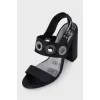 Leather sandals with heels decorated with eyelets