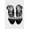Leather sandals with heels decorated with eyelets