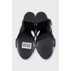 Leather sandals with heels decorated with eyelets
