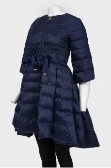 The dark blue jacket is flared up