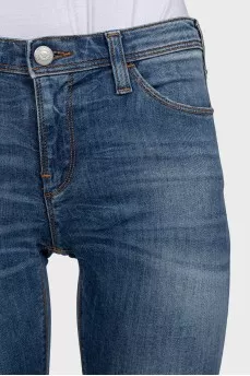 Mid-rise skinny jeans with distressing