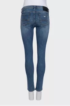 Mid-rise skinny jeans with distressing