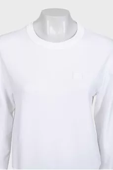 White sweatshirt with a branded patch