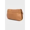 Brown leather bag with gold logo