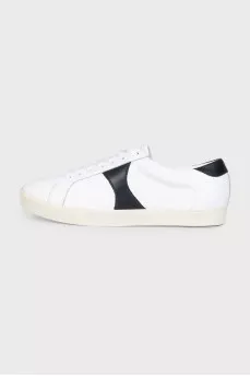 Sneakers with black inserts and a tag