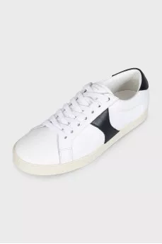 Sneakers with black inserts and a tag