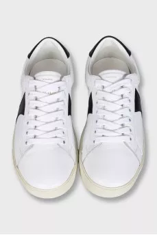 Sneakers with black inserts and a tag