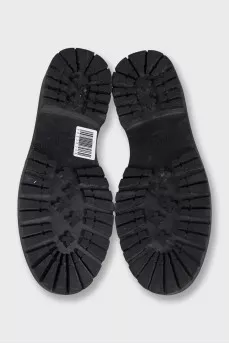 Black leather loafers with signature logo
