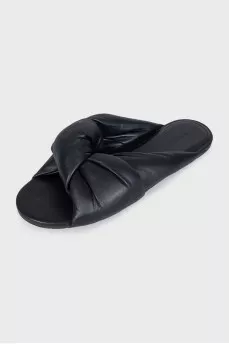 Black leather flip flops with tag