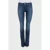 Flared jeans with a distressed effect