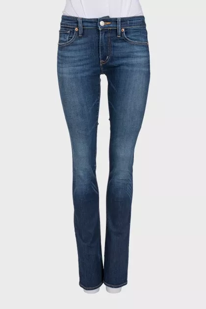 Flared jeans with a distressed effect