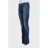 Flared jeans with a distressed effect