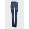 Flared jeans with a distressed effect