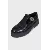 Black embossed leather shoes