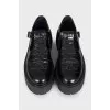 Black embossed leather shoes