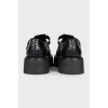 Black embossed leather shoes