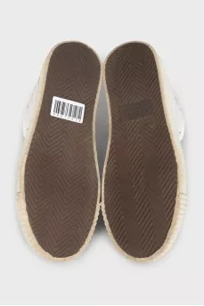 High-top sneakers with a signature logo