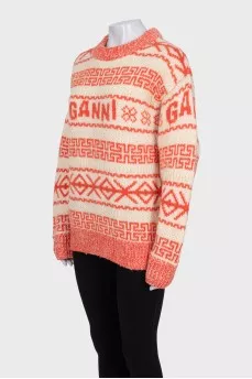 Orange sweater with knitted logo