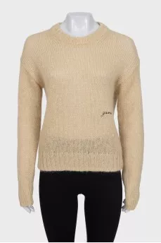 Translucent jumper with embroidered logo